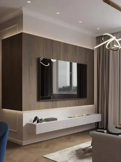 A minimalist approach to a TV unit, where the wood-paneled wall itself becomes the feature. The floating white console and subtle backlighting keep the focus on clean lines and an uncluttered aesthetic, perfect for a modern living space.