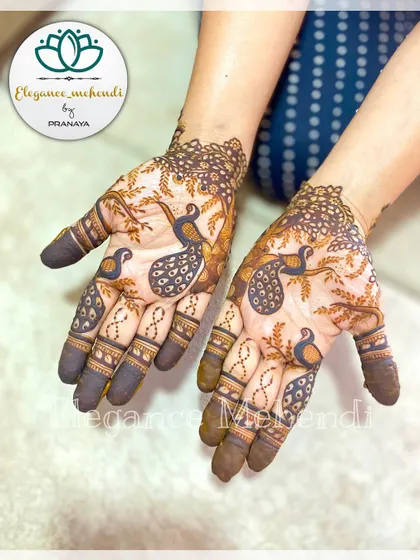 A unique design featuring a family of peacocks resting on tree branches. This artistic and imaginative style is perfect for someone who wants their mehendi to tell a story.