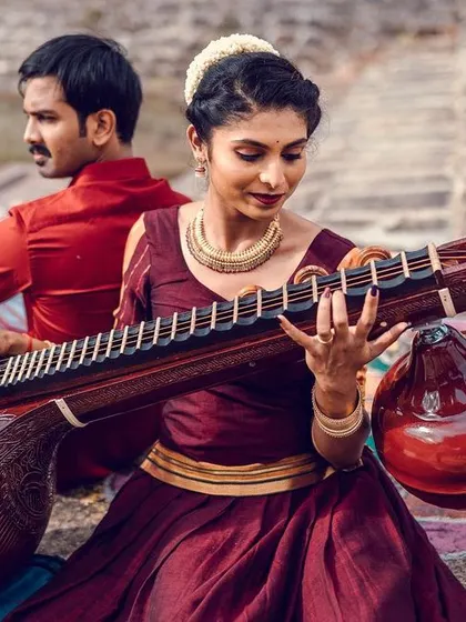A duplicate of the traditional pre-wedding shoot image with the veena.