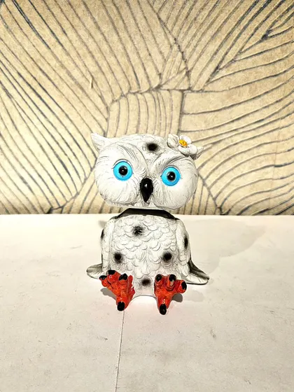 The same bobble-head owl in a white and black finish. Its head gently bobbles, adding a bit of interactive fun to your decor.