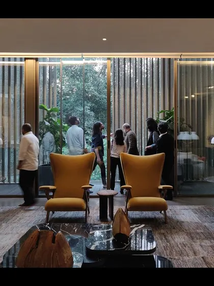 The living area of a residence, where my team is observing the quality of light through floor-to-ceiling windows. The design aims to dissolve the boundary between the interior and the garden.