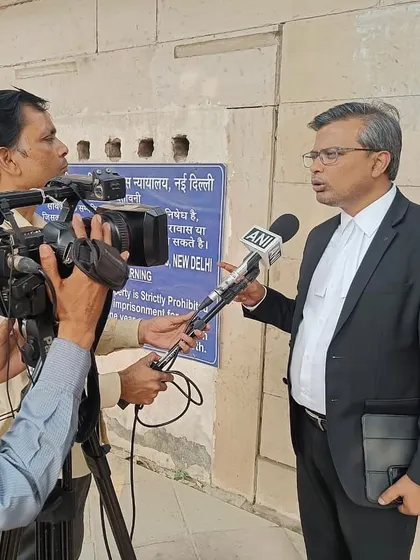 Giving an interview to an ANI reporter outside a New Delhi court, providing an update on a bail hearing.
