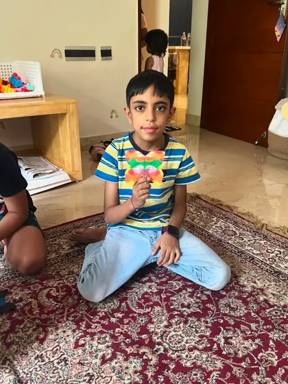 This young man created a wonderfully colorful rainbow butterfly.