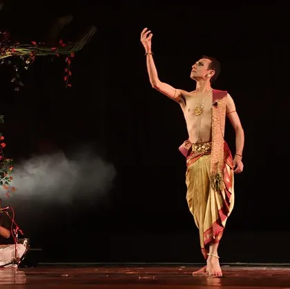 A solo moment within the group production of "Ṛtu Vismruthi." Here, I am portraying a character reflecting on the changing seasons, with the live orchestra providing the emotional soundscape.