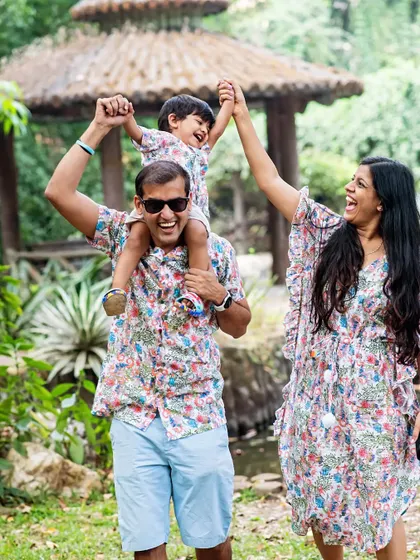 Pure joy. A father lifts his son up in the air during their outdoor family photoshoot. Capturing action and laughter like this is what makes these sessions so special.
