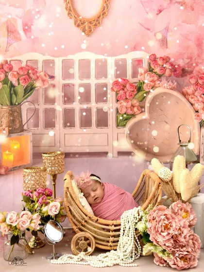 An artistic edit of the vintage pink vanity setup, with added sparkle and soft focus to enhance the dreamy, fairy-tale quality of the newborn portrait.