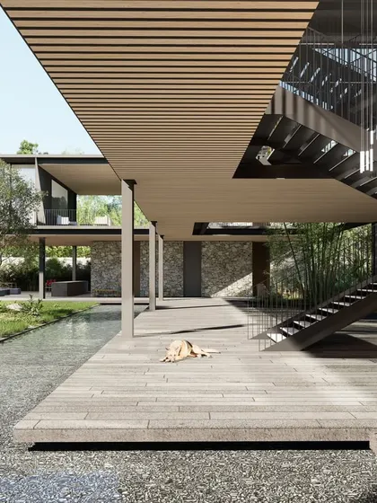 A detail of the clubhouse, showing the interplay of materials like wood decking, a shallow water channel, and a sculptural steel staircase. The design creates a series of interconnected indoor and outdoor spaces that encourage residents to come together.