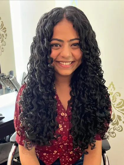 A beautiful smile and even more beautiful curls. This cut is all about celebrating natural texture.