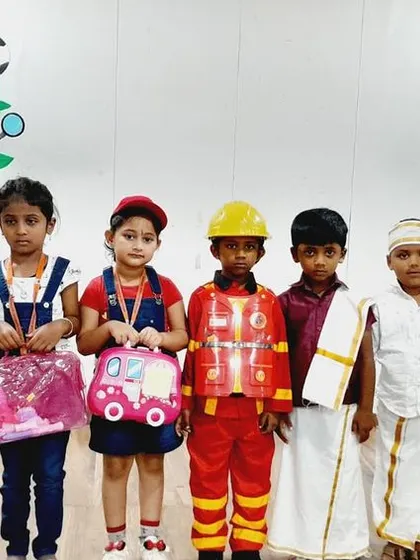 Students dressed as a variety of community helpers, including a firefighter and a traditional farmer, showcasing the diversity of roles in our society.