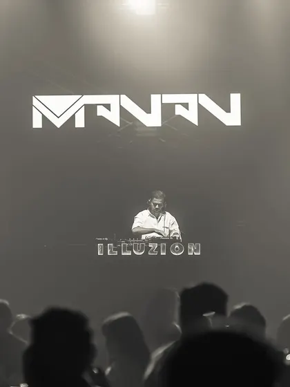 A dramatic black and white shot of me on the massive stage at Illuzion, Hyderabad.