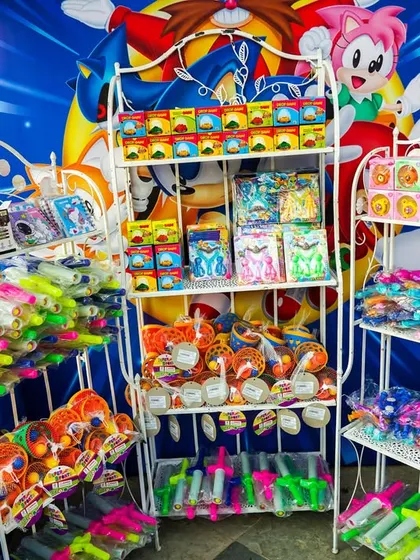 A close-up of the prizes available at the Sonic gift house, including water guns, games, and other fun toys.