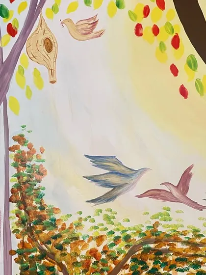 A detail from The Gender Lab mural, showing birds flying freely. This element represents the freedom and hope that the organization stands for.