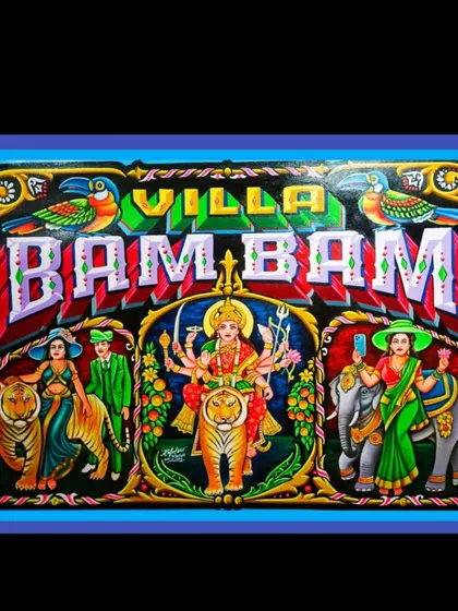 The "Villa Bam Bam" painting, featuring a central portrait of the goddess Durga, flanked by modern and traditional figures.