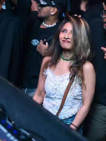 A candid shot of someone in the crowd, completely lost in the music.