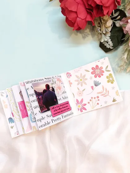 The floral patterns on this page give the mini scrapbook a soft and pretty feel.
