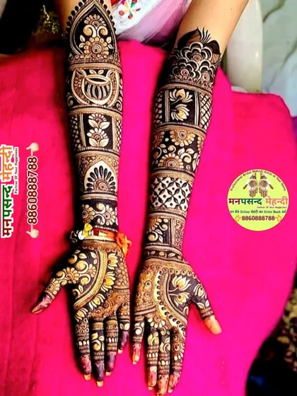 A beautiful design featuring a mix of lotuses and traditional Indian motifs. The use of dark and light shading gives the design a wonderful depth.