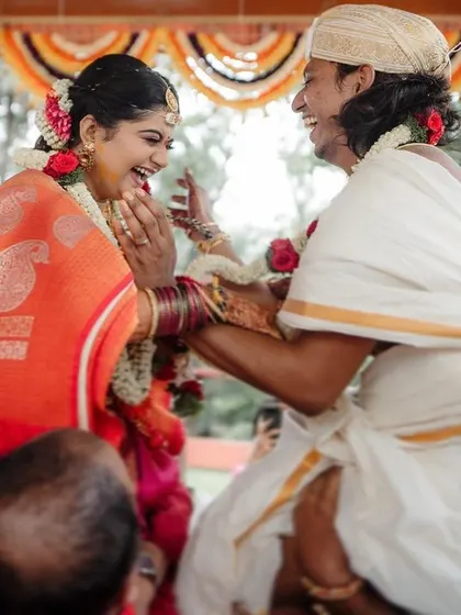 A playful and joyous moment during a South Indian wedding ritual. We capture the fun and laughter that are an essential part of these beautiful traditions.