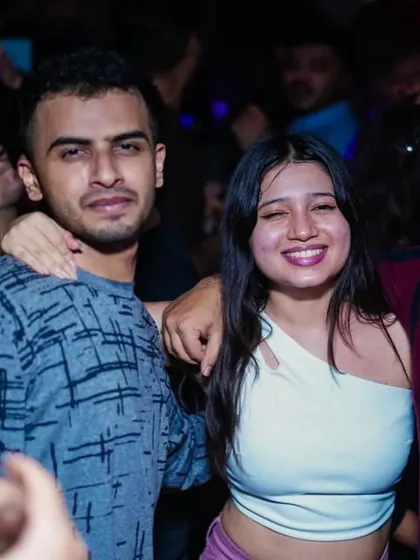 A candid moment of fun and laughter on the dance floor.