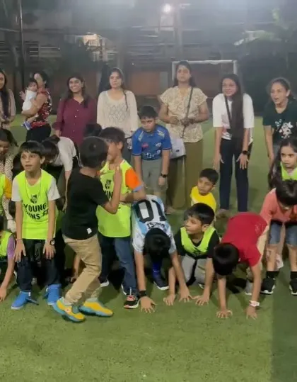 Kids and parents getting ready for a game. We encourage family participation to make the day special for everyone.