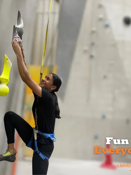 Fun for everyone is our goal. Here, a climber enjoys one of the unique holds on our walls.
