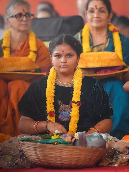 A young girl participates in the Shat Chandi Homa, representing the purity and devotion of the next generation. We encourage people of all ages to be part of these sacred traditions.