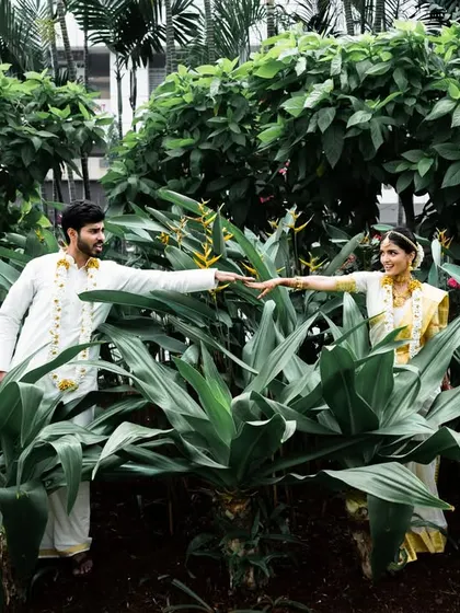 A creative "Creation of Adam" inspired pose, showing the couple's connection in a unique and artistic way.