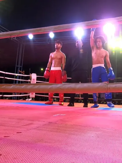 The referee raises Subhan's hand in victory after a dominant semi-final performance.