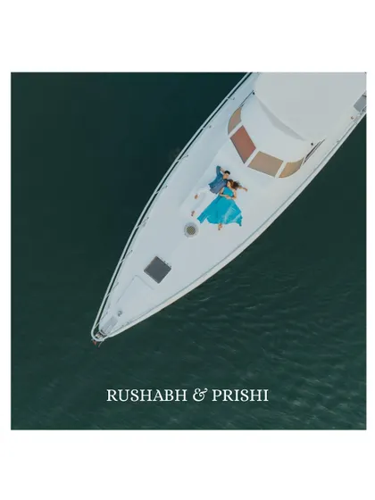 A breathtaking aerial view of a couple finding their own world on a luxury yacht in Goa. This drone shot captures the scale of the ocean and the intimacy of their moment together.