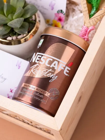 A detail shot of the premium coffee included in a birthday hamper, showing that I source high-quality, branded products for my gifts.