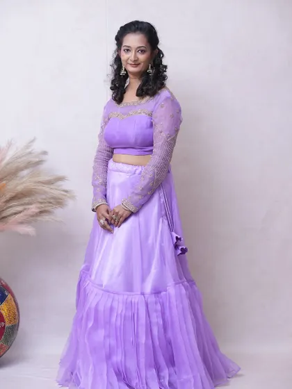The simple yet elegant design of this lavender lehenga makes it a versatile choice for various occasions.