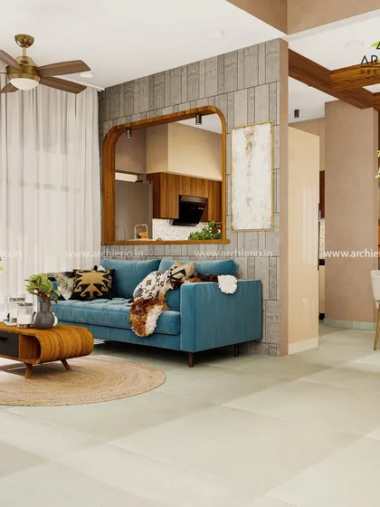 This living room combines a rustic wooden mirror frame and coffee table with a modern blue sofa. The result is a warm, inviting, and stylish space.