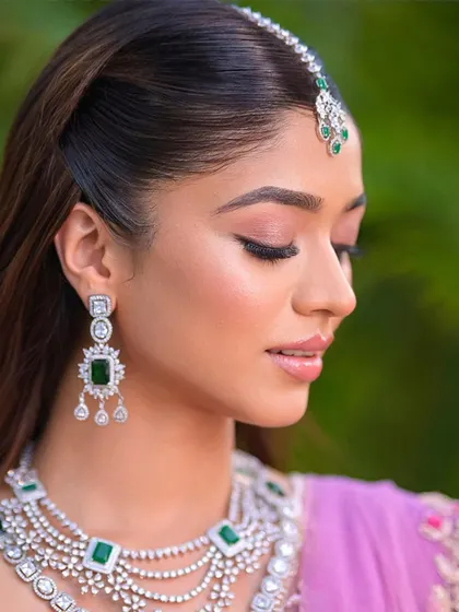 A close up profile shot of the soft, elegant half up hairstyle. It’s a versatile look that feels both formal and effortlessly beautiful.