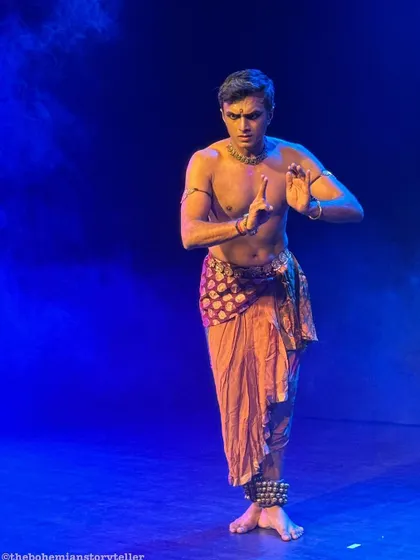 A strong, classic Bharatanatyam stance from our duet 'ATAH'. The blue lighting and my focused expression create a powerful stage presence.