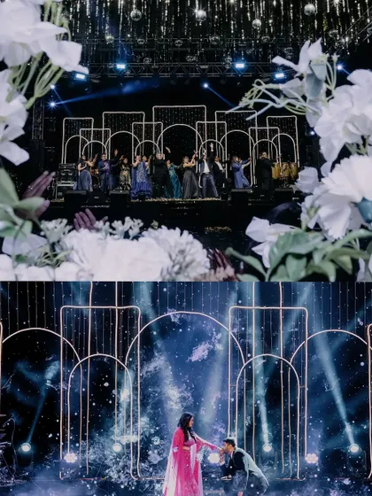 A beautiful moment of the groom bowing to his bride on stage. The modern, illuminated arch backdrop frames this romantic gesture perfectly, while the floral foreground adds a soft touch.