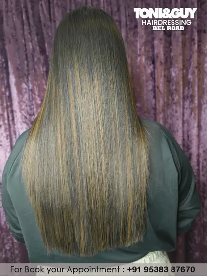 For clients who prefer a sleek look, highlights can add incredible dimension to straight hair. These subtle, lighter strands break up the color and create the illusion of more volume.