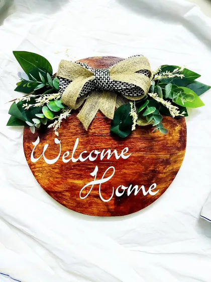 A slightly different version of our popular "Welcome Home" sign. Each one is handmade, so there are always unique variations in the wood grain and finish.