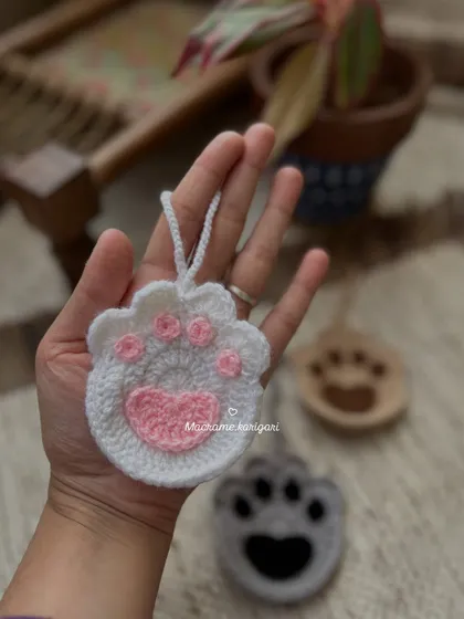 For the cat lovers, a sweet paw-print pouch. The pink heart detail on the paw is a lovely touch. This can be used as a small coin purse or a charm.