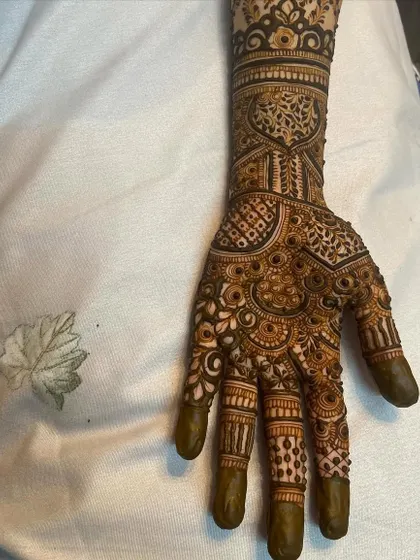 This is a detailed view of my intricate bridal henna work. Each design is unique, combining traditional patterns like paisleys and mandalas with fine-line fillers to create a stunning, full-coverage look for your special day.