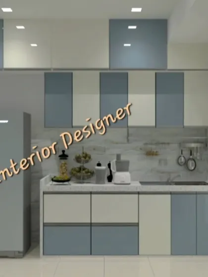 A simple and elegant modular kitchen in a two-tone blue and white color scheme.
