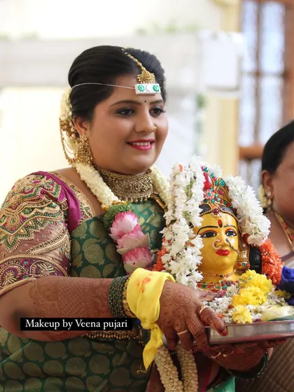A beautiful moment from a traditional ceremony. The bride's makeup is soft and glowing, making her look serene and divine.