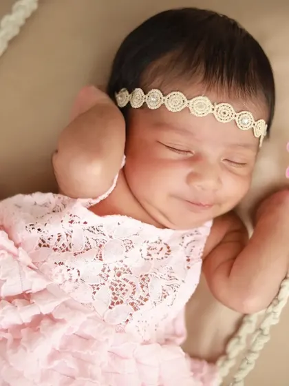 Such a sweet, sleepy smile. Capturing these little expressions while they dream is one of the best parts of my job.