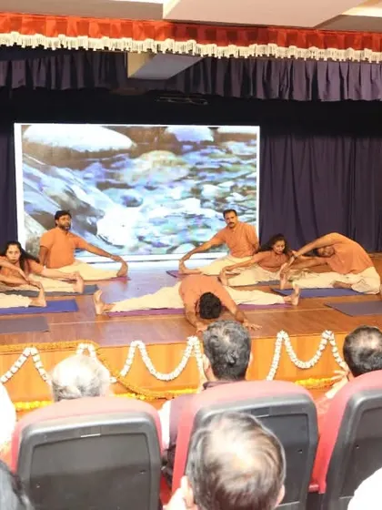 Another view of our students' yogasana demonstration during our 12th-anniversary event. The performance, watched by an engaged audience, was a testament to their hard work and the creative expression that yoga can inspire.