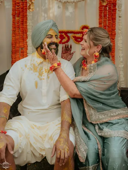 A playful moment during a Sikh wedding's Haldi ceremony. I love capturing these cross-cultural interactions and genuine smiles.
