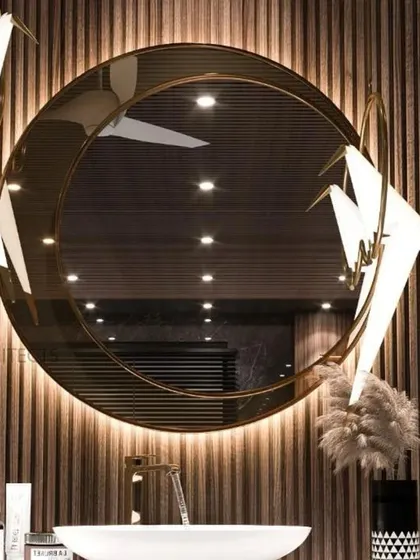 This bath area emanates opulence with its freestanding bathtub and a vanity that combines marble and veneer. The gold PVD finish lion emblem as a water sprout adds a touch of old-world luxury, balancing refined elegance with a contemporary aesthetic.