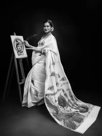 Creating life while painting divinity. A beautiful black and white portrait celebrating the creator of art and life, with a Krishna theme.