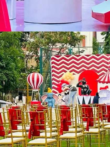 A glimpse of the seating arrangement at a carnival party, with red sashes on the chairs and character cutouts like Dumbo adding to the festive atmosphere.