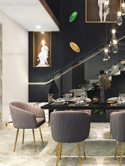 A closer look at the Meera Bagh dining space, where the super black finish is paired with warm tones and sculptural art to create a space that embodies modern aesthetics.