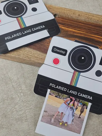 Duplicate of 63. This Insta Cam Pull-Up Card is a creative way to present a photo. The card is shaped like a vintage polaroid camera, and the picture slides out from the bottom.