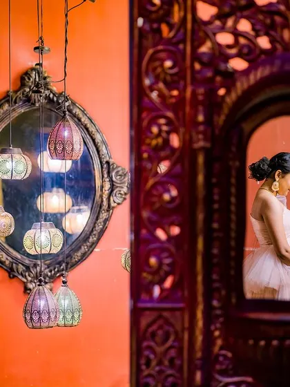 An artistic and reflective maternity portrait. I captured the mom-to-be's silhouette in an ornate mirror, creating a quiet, introspective image that focuses on her connection with her baby.