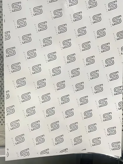 Another view of the branded wrapping paper, showing the consistency and quality of the print.